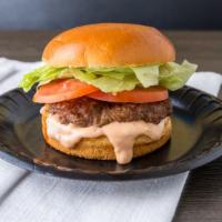 Burger · A 1/3 lb Burger on a brioche bun with lettuce, tomato & Big Sauce.