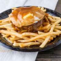 Moco Fries · Fries topped with a burger patty then smothered with brown gravy and an over-easy egg.