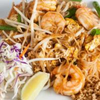 Pad Thai · Thai style pan fried thin rice noodle with eggs. tofu, bean sprouts, green onions, fresh lim...