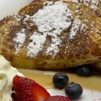 French Toast · 2  toast cut in 1/2, maple syrup, red fruit and whipped cream , butter