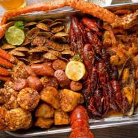 Cooked Seafood Family Platter · Serves 4  and includes steamed rice and baguette

Maine lobster, king crab, dungeness crab, ...
