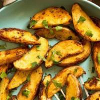 Fried Potato Wedges · Fresh cut potato wedges with skin