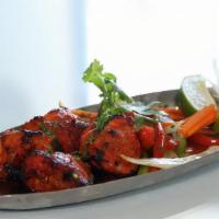 Tandoori Chicken Tikka · Chicken marinated with spices and char grilled in the tandoor grill.