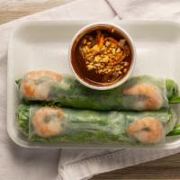 Goi Cuon Tom Thit · Two spring rolls with pork, shrimp, rice noodles and vegetables, served with peanut sauce.