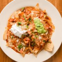 Nachos With Meat · Choice of meat. Topped with beans, enchilada sauce, cheese, sour cream, guacamole and pico d...