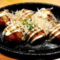 Takoyaki (Fried Octopus Ball) · Fried Octopus balls with special sauce and fish flakes