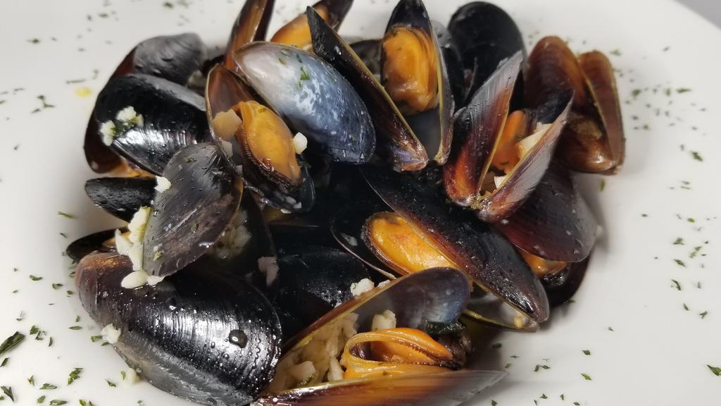 Drunken Mussels · Wine steamed black mussels with garlic and Buttery sauce