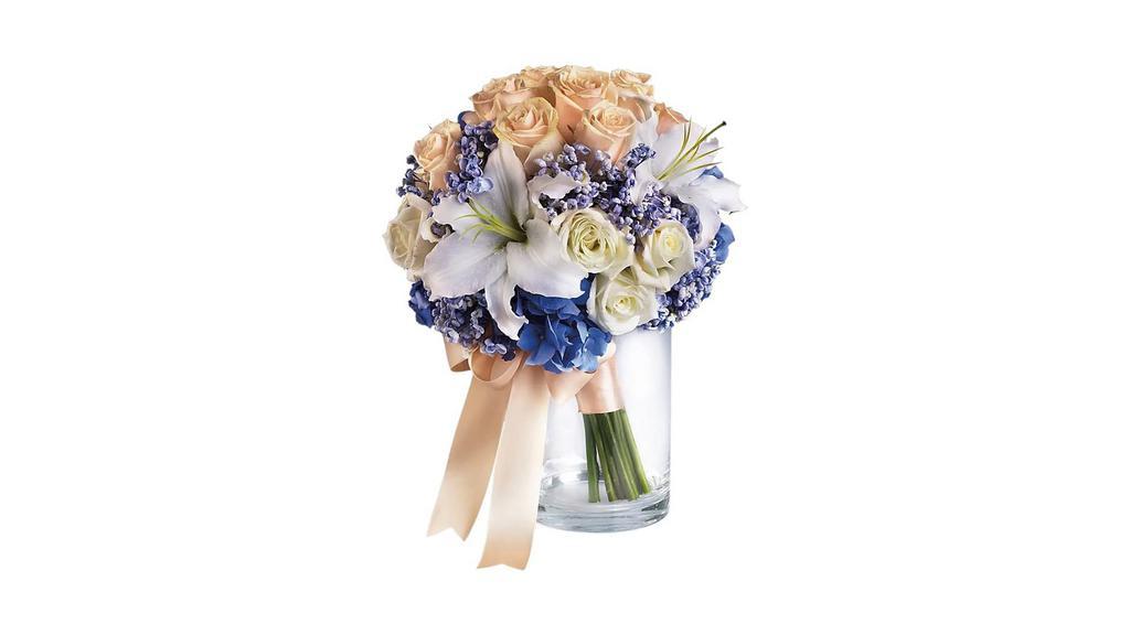 Nantucket Dreams Bouquet · Bouquet will be delivered approximately as pictured. Evoke the soft splendor of the sea with this beautiful upscale bouquet of hydrangea, roses and lilies. Blue hydrangea and white lilies combine beautifully with chrome and white roses.