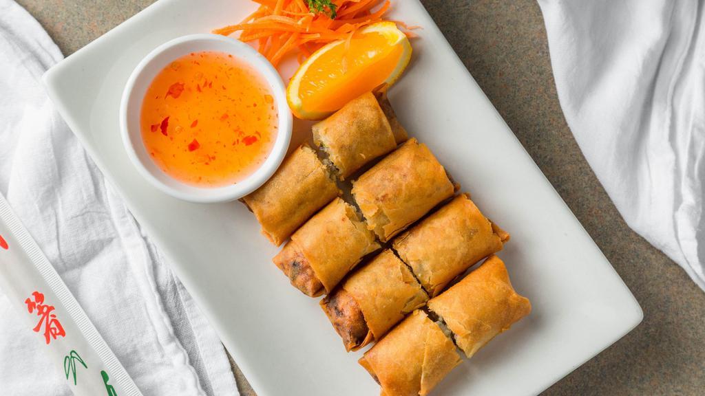 Fried Chicken Egg Rolls  · Golden fried Thai egg rolls with chicken, crystal noodles, carrots, celery, mushrooms, and cilantro, served with sweet and sour sauce.