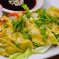 Pot Stickers · Crispy fried chicken or pork pot stickers filled with veggies, served with a garlic lime soy...