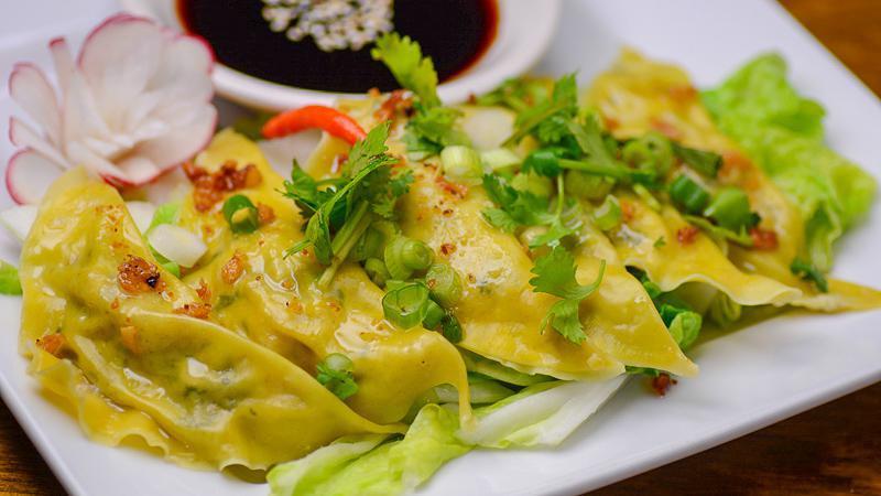Pot Stickers · Crispy fried chicken or pork pot stickers filled with veggies, served with a garlic lime soy sauce.