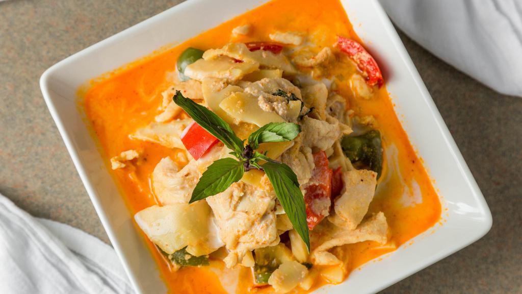 Spicy Red Curry · Choice of meat in a spicy red curry sauce with bamboo shoots, bell peppers, Thai basil, and coconut milk.
