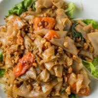 Spicy Drunken Noodles (Pad Kee Mow) · Minced chicken sauteed with wide rice noodles, tomatoes, and Thai basil in a spicy chili gar...