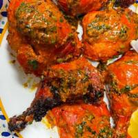 Tandoori Chicken · Chicken marinated in yogurt,garlic, ginger and fresh ground spices.