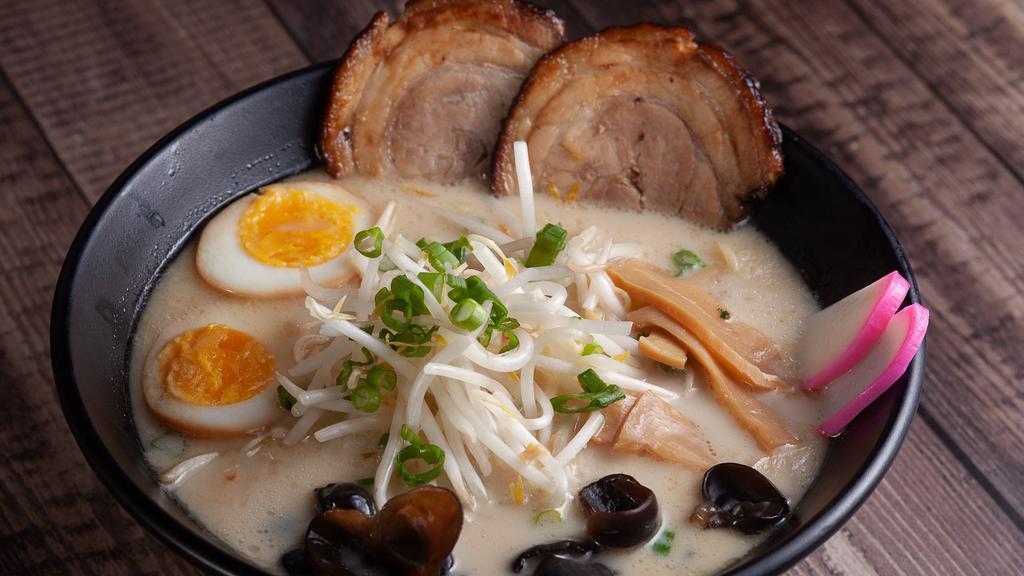 Tonkotsu Ramen · Roasted pork, boiled egg, kikurage mushroom, bamboo shoots, green onions, sprouts, and fish cake.