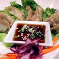 Pot Stickers · Pan-fried vegetable and mushrooms stuffed dumplings. Served with Thai ponzu sauce.
