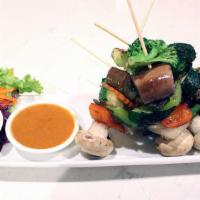 Veggie Satay · Pan-fried seasonal vegetables and mushrooms marinated in curry powder and coconut milk. Serv...