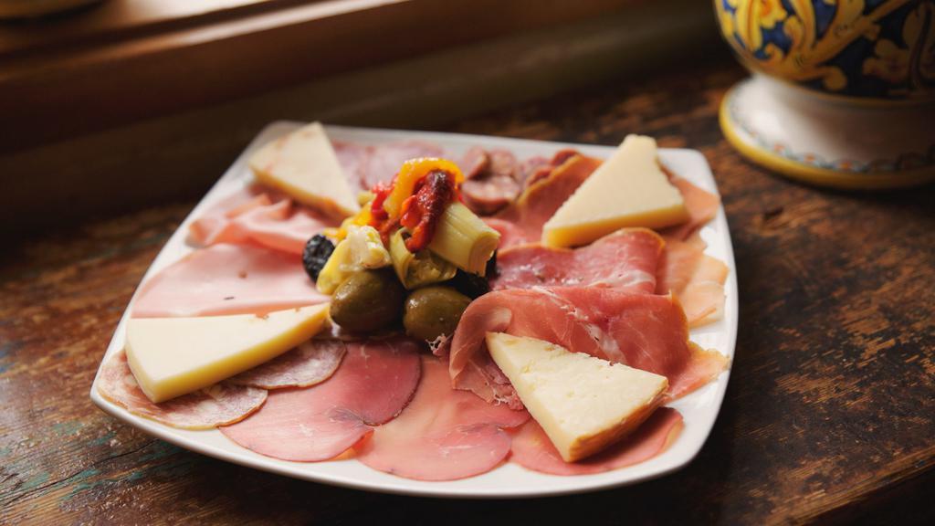 Antipasto Misto · A selection of Italian cured meats, cheeses, marinated artichokes and olives.