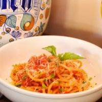 Bucatini All'Amatriciana · Traditional Italian bucatini
pasta sautéed with fresh pelati
tomatoes, sweet onions,
importe...