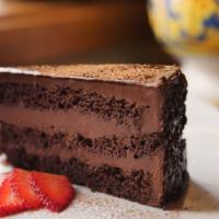 Chocolate Fondant Cake · Chocolate layer cake, altering layers of chocolate sponge cake and chocolate cream, covered ...