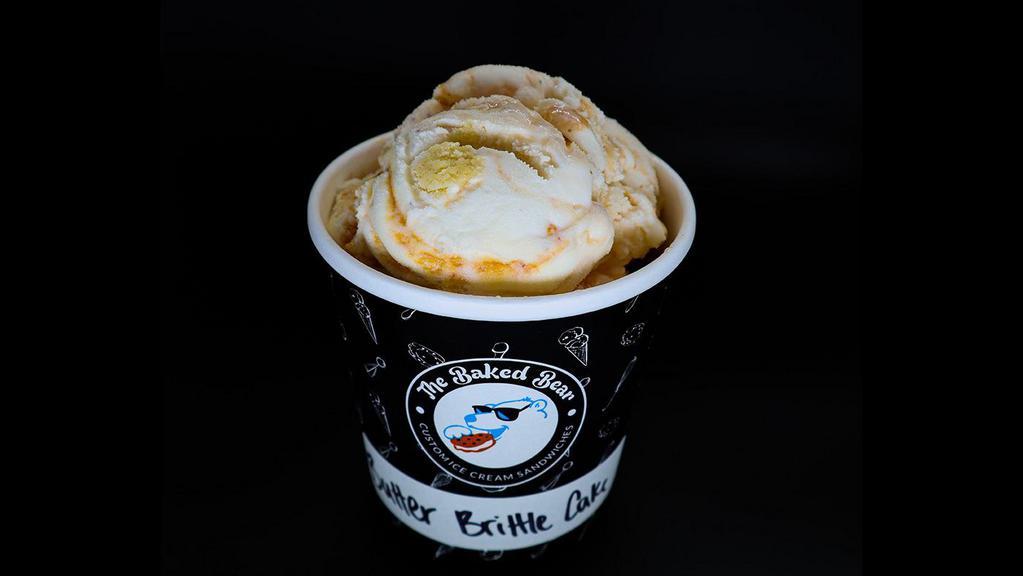 Butter Brittle Cake Pint · Vanilla Bean Ice Cream Layered w/ Butter Brittle, Almonds & Vanilla Cake.