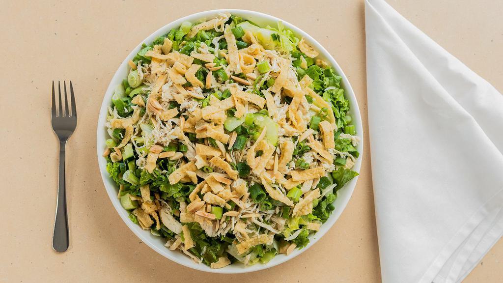 Large Chinese Chicken Salad · Mix of greens with shredded chicken, cucumbers, green onion, and sesame seeds, with sweet sesame oil dressing. Wontons and almonds packed separately.