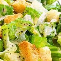 Caesar Salad · Caesar salad with romaine lettuce, parmesan cheese, and side of Caesar dressing.