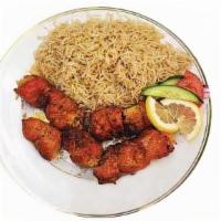Chicken Kebab · Broiled chunks of chicken breast marinated in spices served with white rice & salad.