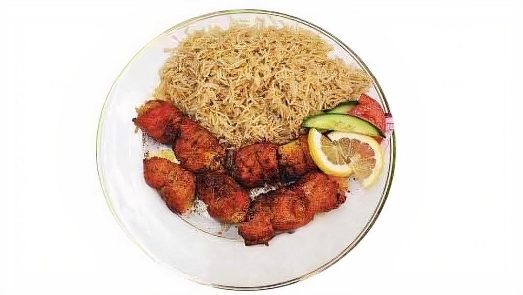 Chicken Kebab · Broiled chunks of chicken breast marinated in spices served with white rice & salad.