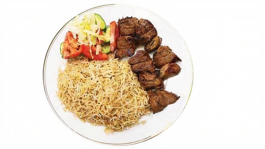 Lamb Kabab · Broiled chunks of lamb marinated in spices served with white rice & salad.