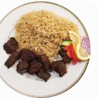 Beef Kebab · Broiled chunks of beef marinated in spices served with white rice & salad.