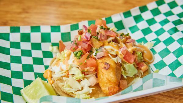 Baja T · Handmade corn tortilla, fried battered fish, pico de gallo, cabbage, sour cream, chipotle aioli

Combo- 2 baja tacos, rice, beans served with chips and salsa