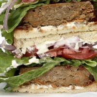 Smoked Vegan Meatloaf · Cherry-smoked Vegan Loaf Patty, Green Leaf Lettuce, Sliced Tomato, Red Onions, House Made Ve...