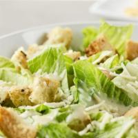 Caesar Salad · Chopped Romaine Lettuce, Shredded Parmesan Cheese and house-made Croutons Tossed in Dad's Ca...