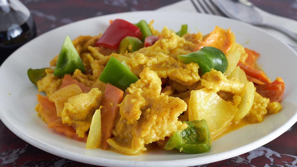 Curry Chicken · Served with choice of curry and rice. Hot and spicy.