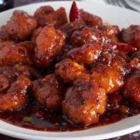 Orange Chicken · Served with white chicken meat and steamed rice.