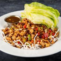 Chicken Lettuce Cup · Minced chicken, water chestnuts,
mushrooms, and bell peppers on crispy
rice noodles. Served ...