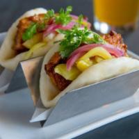 2 Pieces Pork Belly Bao · Braised pork belly, pickled mustard greens, pickled red onion, hoisin, Sriracha and cilantro...