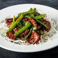Mongolian Beef · Flank steak, garlic and green onion stalks, tossed in a sweet savory sauce and served on a b...