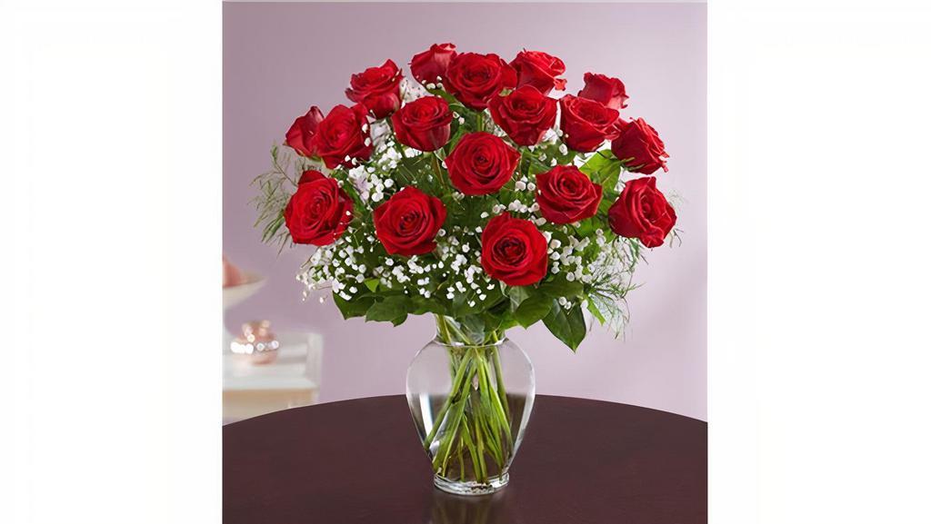Rose Elegance™ Premium Long Stem Red Roses · Our florists select the freshest flowers available, so shade of rose may vary due to local availability Artistically designed in a clear glass vase 18-stem arrangement measures approximately 22