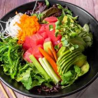 Ahi Poke Salad · Spring mix, ahi tuna, avocado, radish, masago, cucumber & seaweed salad, green onion & cilan...