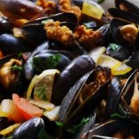 Steamed Mussels With Sausage And Fries · Blue mussels from Chile steamed in a white wine, garlic and herbs blend, topped with Italian...