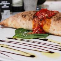 Spicy Sausage Calzone · Spicy sausage crumble, Provolone, marinara, bell peppers.