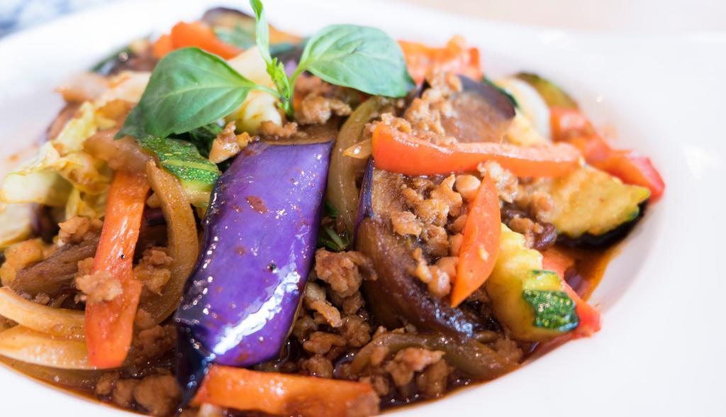Spicy Eggplant Lover · Eggplants, fresh garlic, chili, onions, zucchinis, red bell peppers, cabbage and basil leaves in oyster sauce.