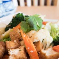 Mixed Vegetables · A mixture of carrots onions broccoli,mushrooms,cabbage,zucchini and fried tofu in garlic sau...