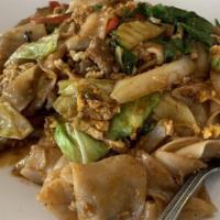 Pad-Kee-Mow · Pan-fried wide rice noodles with egg, chili, onions, red bell peppers, cabbage and basil.