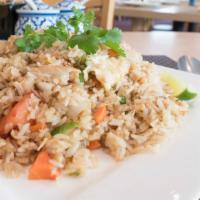 Crab-Meat Fried Rice · Pan-fried rice with crab meat, onions, tomatoes, peas, egg, and green onions.