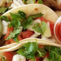 Steak Tacos · 3 soy steak protein tacos, onions, tomatoes, and cilantro corn tortillas. Served with guacam...