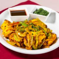 Achari Paneer · Paneer sautéed with indian pickles, full of spices and tangy flavours.