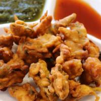 Mix Veg Pakora · Bite size pieces of mixed vegetable, fried in chickpea batter.